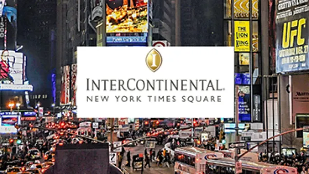 Busy Times Square street scene with InterContinental logo